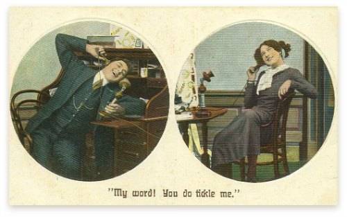 A man and a women talking on candles stick telephones - image circa 1910
