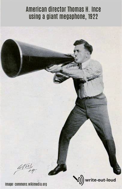 Image: Thomas H Ince, American director, using a giant megaphone, 1922.