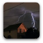 A flash of ligtning over a house on a dark and stormy night. A flash of ligtning over a house on a dark and stormy night.