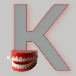 An uppercase letter K - with a set of wind-up teeth! An uppercase letter K- with a set of wind-up teeth!